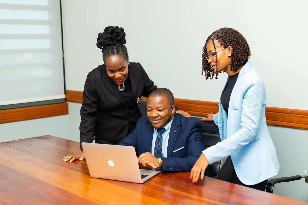 Claritas team reviewing audit findings at a laptop