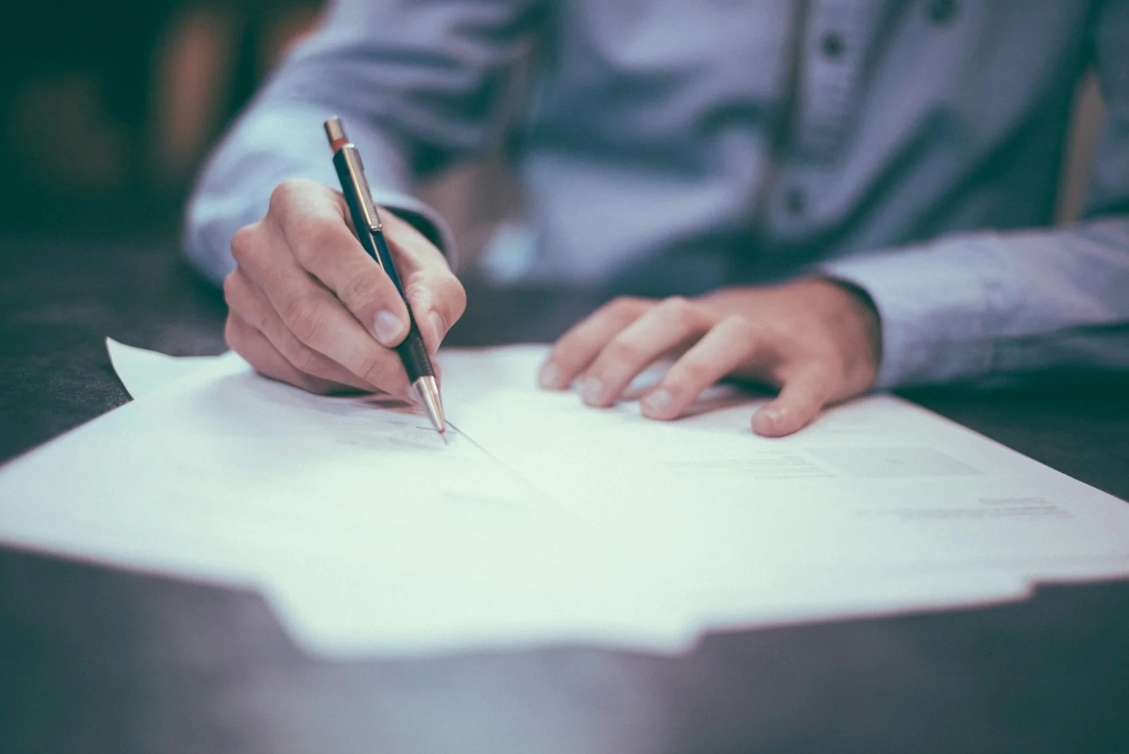 Financial advisor signing documents